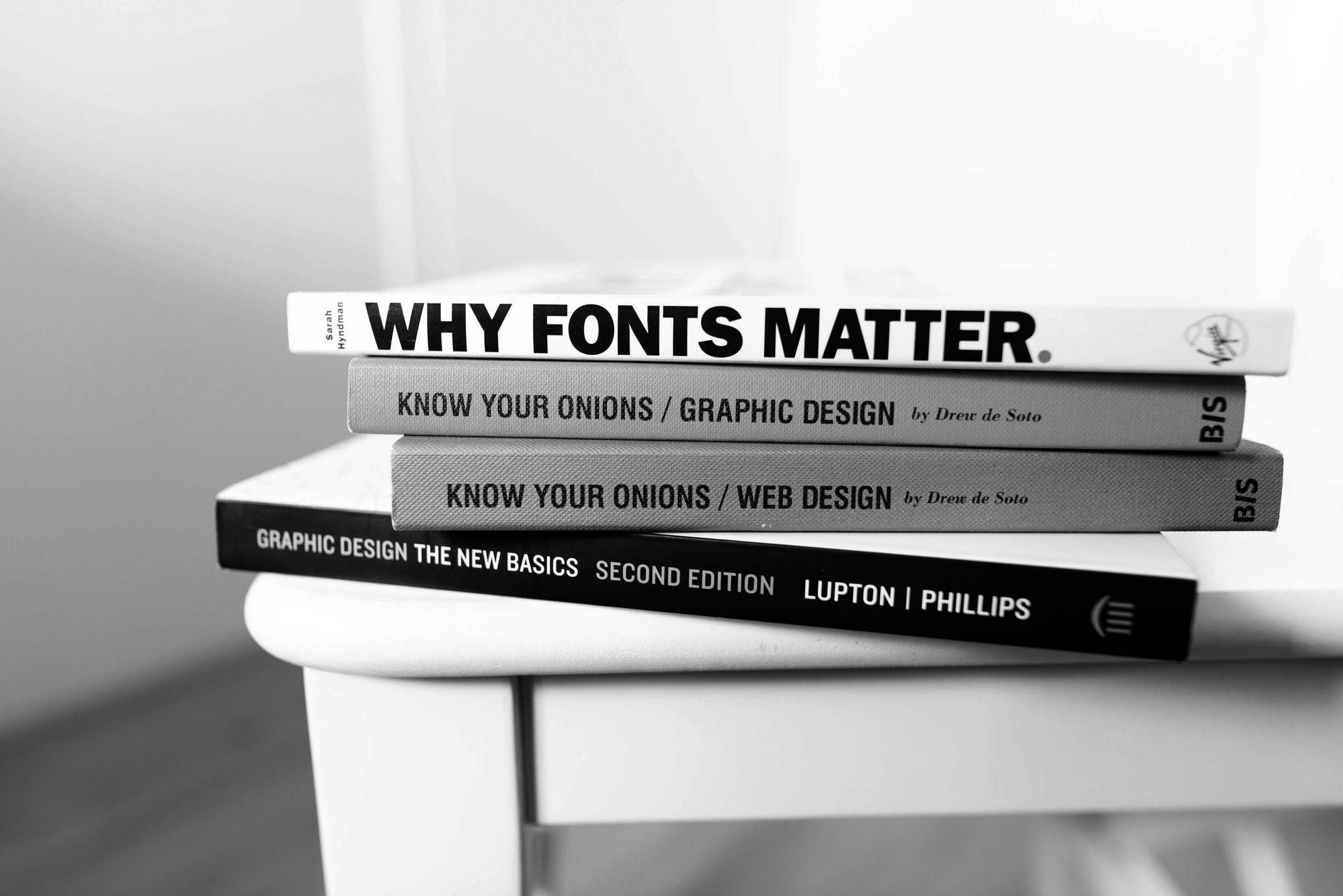 Stack of typography and design books